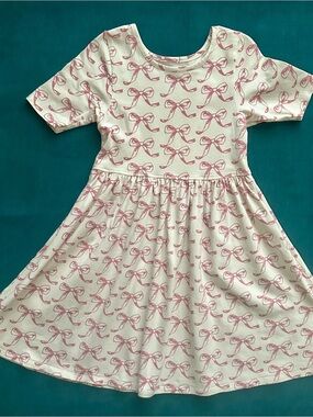 Pink chicken Size 7 Girls' Pink Bow Print Cream Dress